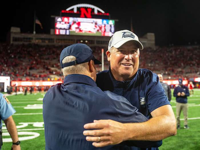 Clay Helton hugs an assistant after beating Nebraska