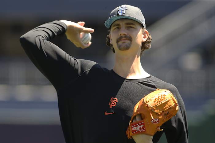 SF Giants pitcher Sean Hjelle warms up before a game.