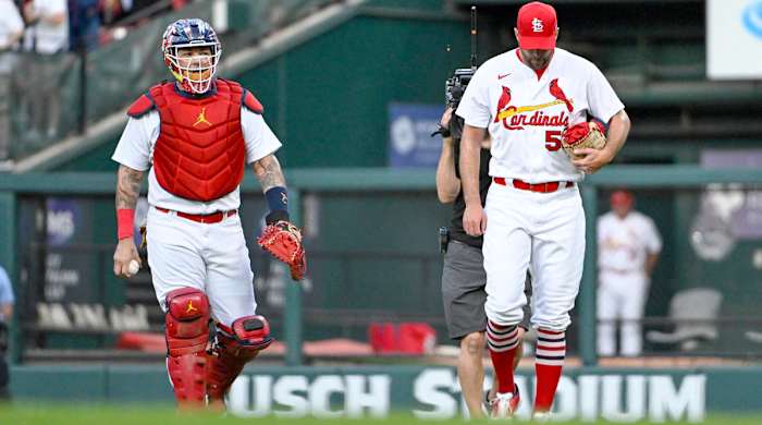 Sep 14, 2022; St. Louis, Missouri, USA; St. Louis Cardinals catcher Yadier Molina (4) and starting pitcher Adam Wainwright (50) walk in from the bullpen before their 325th start as a battery breaking the MLB record before a game against the Milwaukee Brewers at Busch Stadium.