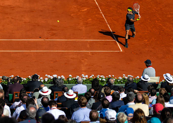 Federer delivers one of his smoothest shots, the backhand return.