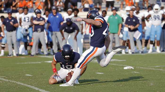 Virginia Cavaliers punter Brendan Farrell (40) kicks the game-winning field goal on the final play of the game against the Old Dominion Monarchs during the fourth quarter at Scott Stadium.