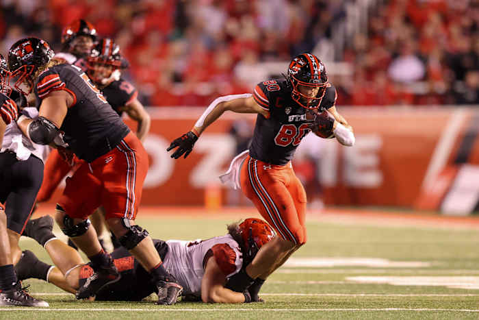 Utah Utes tight end Brant Kuithe (80) catches a pass and is brought down by San Diego State Aztecs defensive lineman Justus Tavai (91) in the second quarter at Rice-Eccles Stadium.