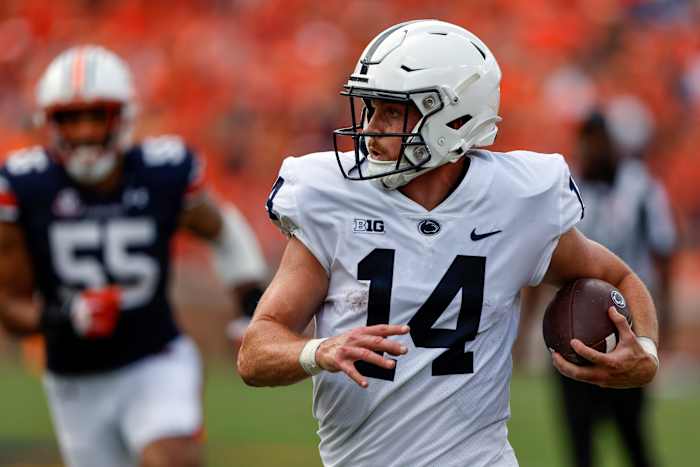 Sean Clifford makes a running play against Auburn.