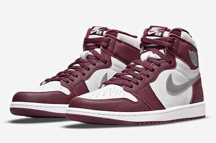 View of maroon and silver Jordan 1 shoes.