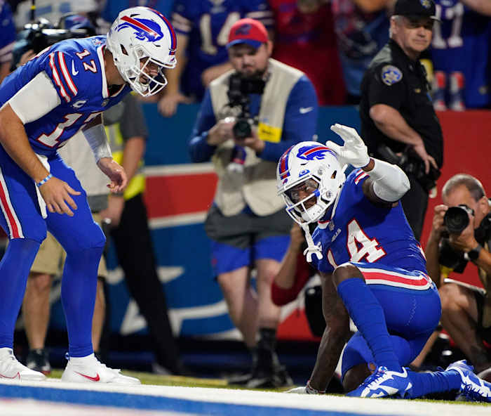 Buffalo Bills quarterback Josh Allen (17) and wide receiver Stefon Diggs (14) celebrate a touch down during the third quarter at Highmark Stadium.