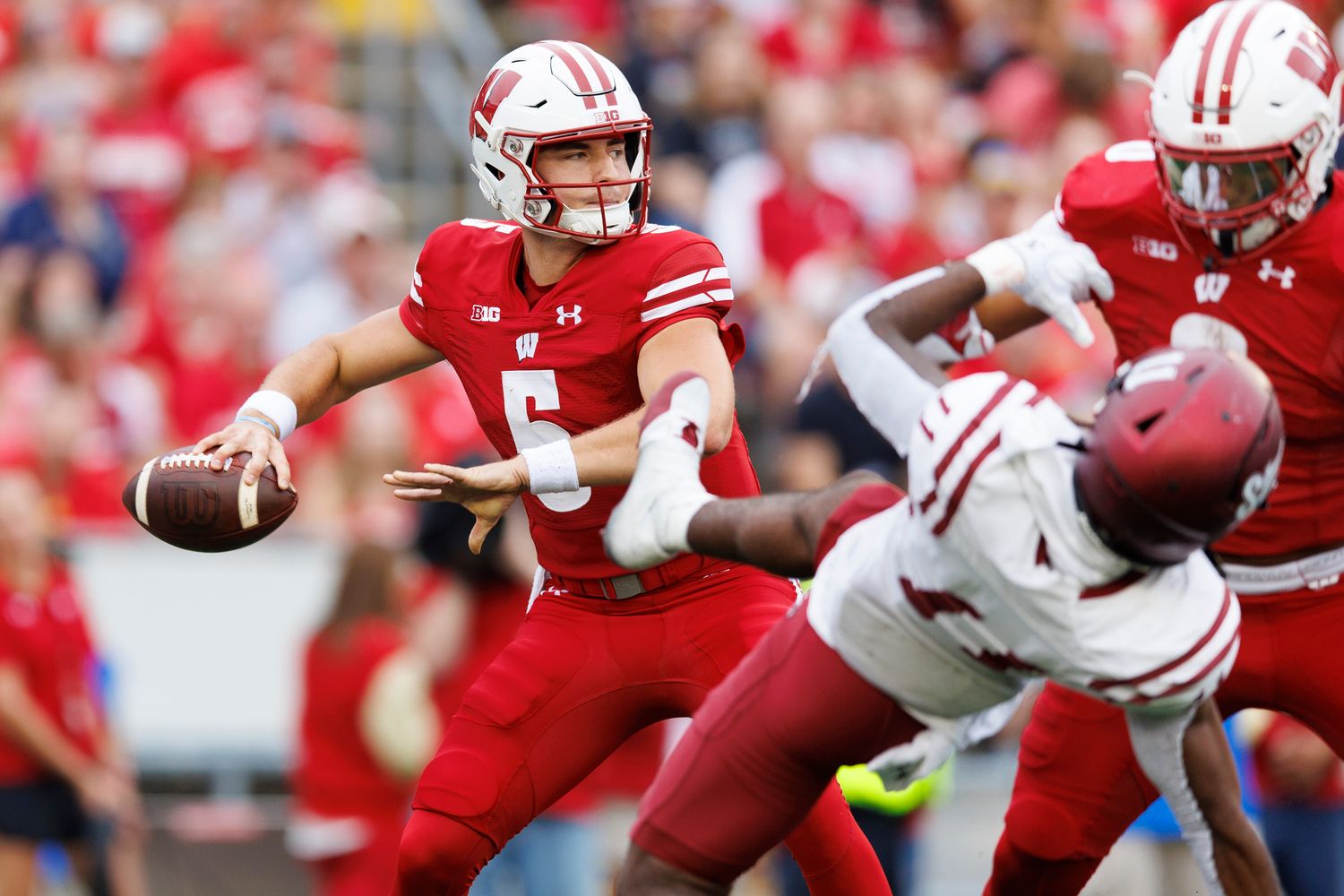 Wisconsin quarterback Graham Mertz dropping back to pass against New Mexico State.