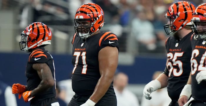 Cincinnati Bengals offensive tackle La'el Collins (71) and the Cincinnati Bengals offensive line come up to the line of scrimmage for a snap in the first quarter of an NFL Week 2 game against the Dallas Cowboys, Sunday, Sept. 18, 2022, at AT&T Stadium in Arlington, Texas. Nfl Cincinnati Bengals At Dallas Cowboys Sept 18 2173