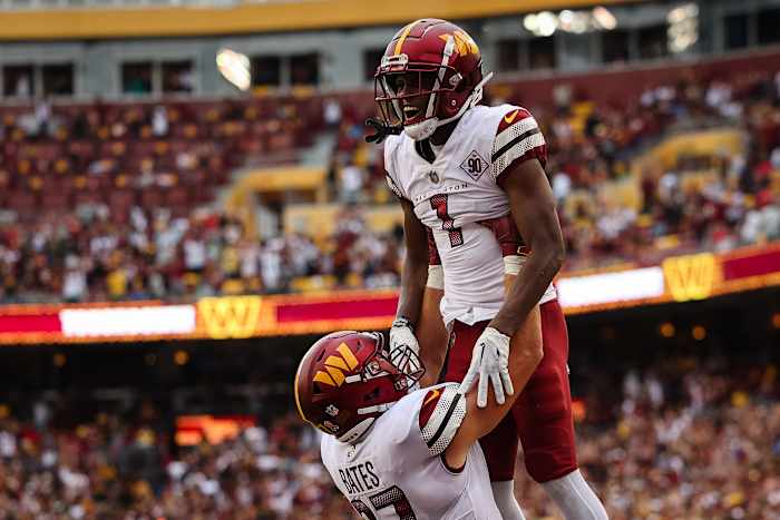 Washington Commanders receiver Jahan Dotson (1) and tight end John Bates (87) celebrate a touchdown against the Jacksonville Jaguars in Week 1 of the NFL Season.