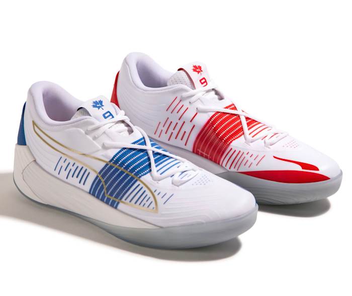 View of white, white, and blue Puma Fusion Nitro shoes.