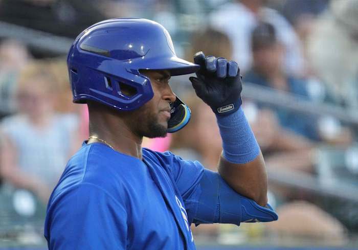 Former SF Giants prospect Alexander Canario grabs his batting helmet during spring training with the Cubs. (2022)