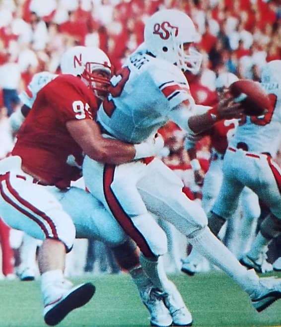 Danny Noonan wraps up Oklahoma State quarterback Rusty Hilger.