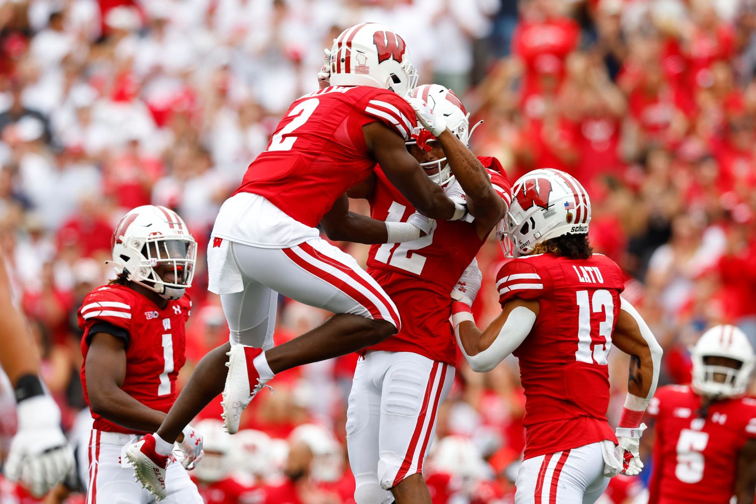 Wisconsin cornerbacks Ricardo Hallman and Max Lofy celebrate an interception against Washington State
