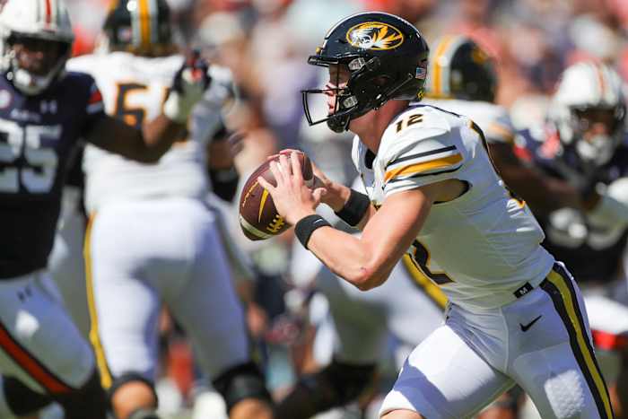 Missouri Tigers quarterback Brady Cook (12) scrambles during the game between the Missouri Tigers and the Auburn Tigers at Jordan-Hare Stadium on Sept. 24, 2022.