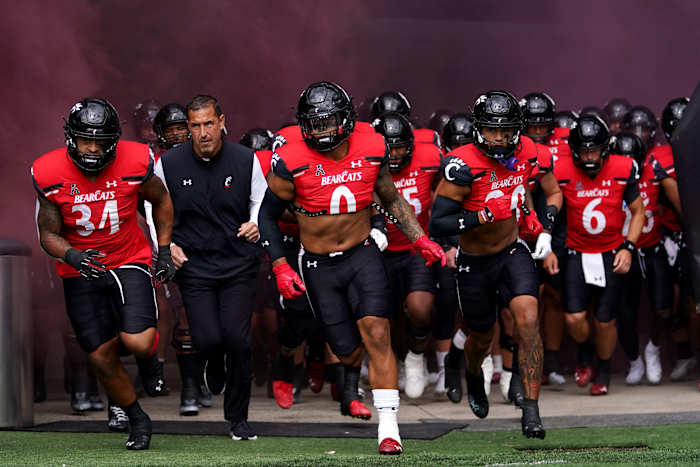 Cincinnati Bearcats head coach Luke Fickell and the Cincinnati Bearcats take the field before the first quarter of a college football game against the Indiana Hoosiers, Saturday, Sept. 24, 2022, at Nippert Stadium in Cincinnati. Ncaaf Indiana Hoosiers At Cincinnati Bearcats Sept 24 0214