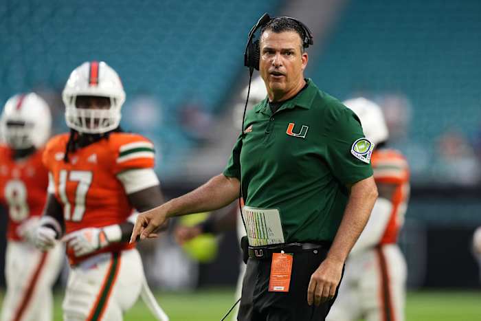 Miami Hurricanes head coach Mario Cristobal walks onto the field during the second half against the Middle Tennessee Blue Raiders at Hard Rock Stadium.