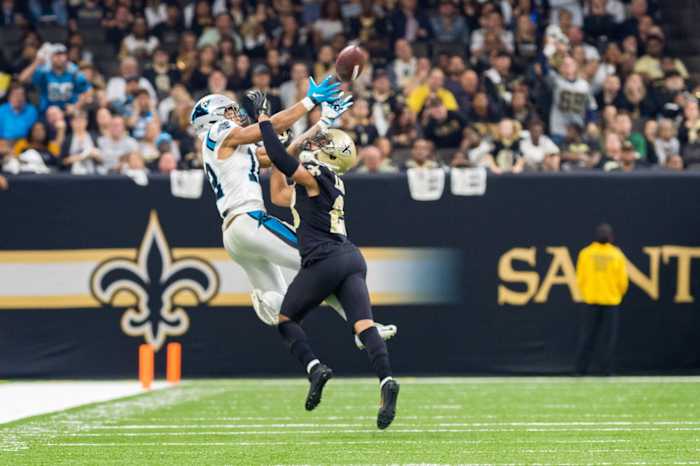 Saints corner back Marshon Lattimore breaks up a pass to Panthers receiver DJ Moore. SCOTT CLAUSE/USA TODAY Network