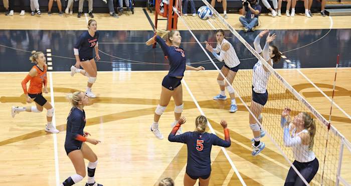 Abby Tadder swings at the ball during the Virginia Cavaliers' volleyball match against the North Carolina Tar Heels.