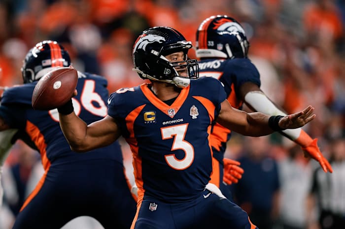Denver Broncos quarterback Russell Wilson (3) attempts a throw in the fourth quarter against the San Francisco 49ers at Empower Field at Mile High.