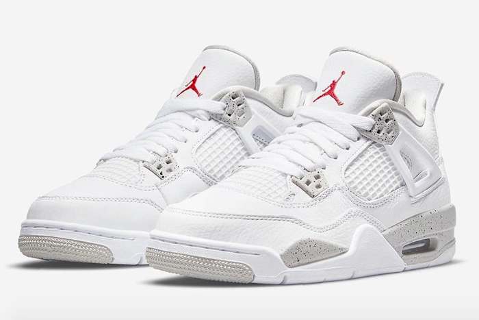View of white and grey Air Jordan 4 shoes.