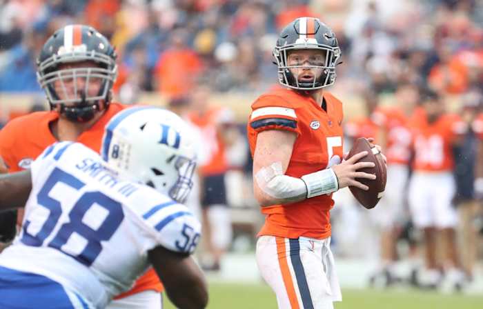 Virginia Cavaliers quarterback Brennan Armstrong surveys the field against the Duke Blue Devils.