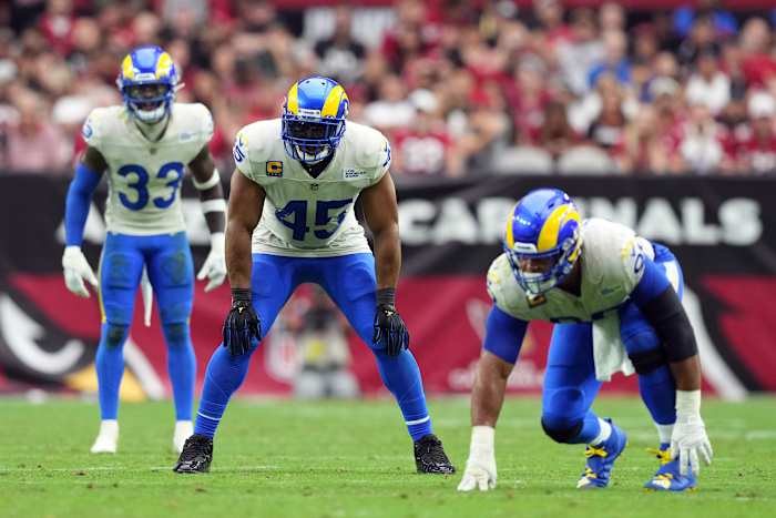 Bobby Wagner alongside safety Nick Scott (left) and Aaron Donald (right)