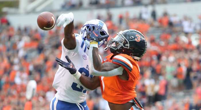 Virginia Cavaliers wide receiver Dontayvion Wicks attempts to catch a pass against the Duke Blue Devils.