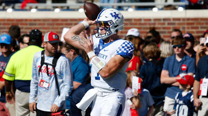 Will Levis warms up for Kentucky at Ole Miss.