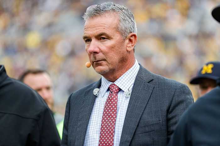 FOX Sports college football analyst Urban Meyer walks along the sideline before a game between Michigan and Maryland at Michigan Stadium in Ann Arbor on Saturday, Sept. 24, 2022.
