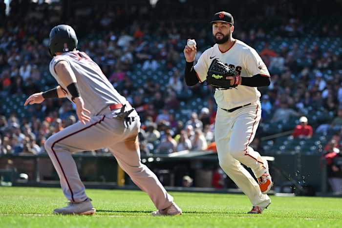 SF Giants pitcher Jakob Junis chases down a Diamondbacks runner. (2022)