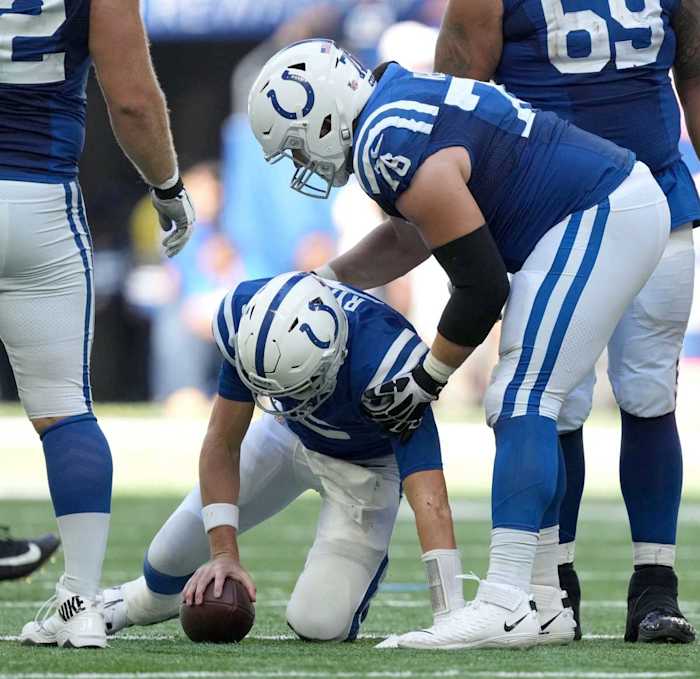 Indianapolis Colts center Ryan Kelly (78) helps Indianapolis Colts quarterback Matt Ryan (2) to his feet after being sacked Sunday, Oct. 2, 2022, during a game against the Tennessee Titans at Lucas Oil Stadium in Indianapolis.