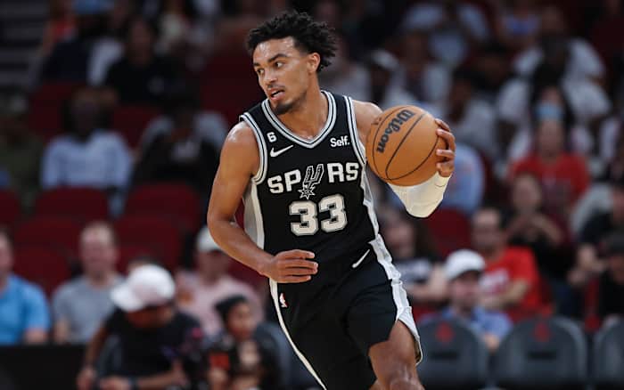 San Antonio Spurs point guard Tre Jones brings the ball up the floor. 