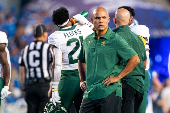 Baylor head coach Dave Aranda standing during warmups against BYU.