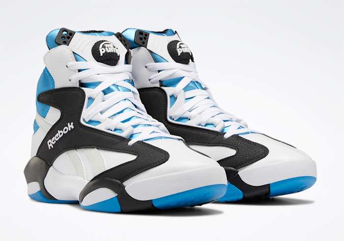 White, black, and blue Reebok Shaq shoes.