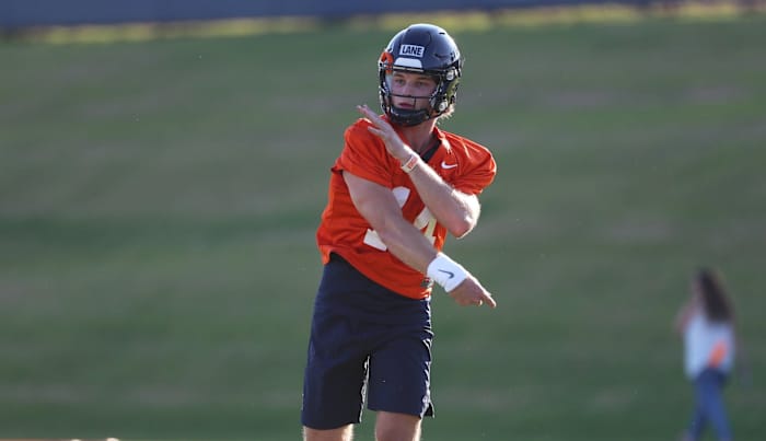 Virginia Cavaliers freshman quarterback Davis Lane Jr. throws the ball during practice.