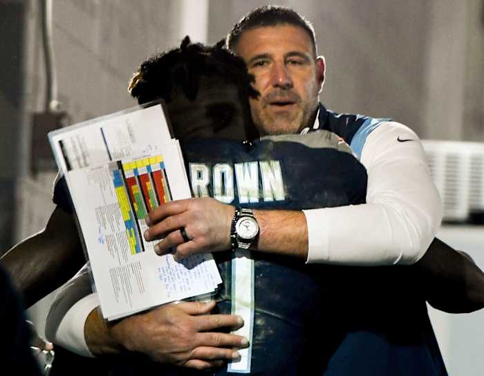 Tennessee Titans head coach Mike Vrabel hugs wide receiver A.J. Brown (11) after they beat the 49ers at Nissan Stadium Thursday, Dec. 23, 2021 in Nashville, Tenn.