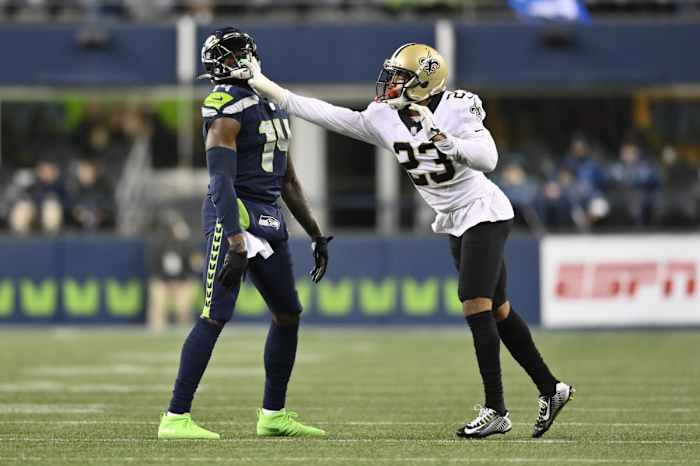 New Orleans Saints cornerback Marshon Lattimore (23) shoves Seattle Seahawks wide receiver DK Metcalf (14). Mandatory Credit: Steven Bisig-USA TODAY Sports