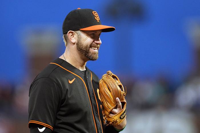 SF Giants third baseman Evan Longoria smiles while in the field.