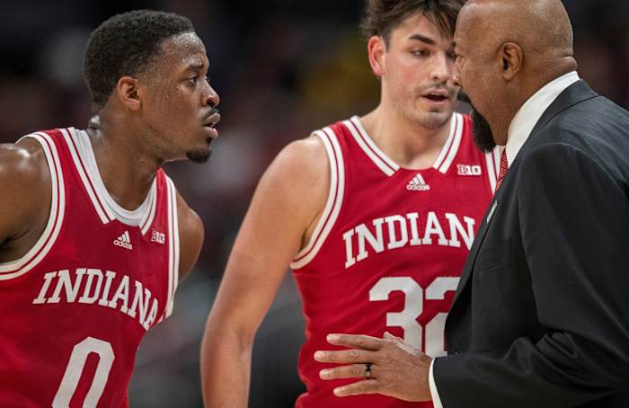 Indiana Hoosiers head coach Mike Woodson talks with guard Xavier Johnson (0) and guard Trey Galloway (32), Thursday, March 10, 2022, during Big Ten tournament mens action from Indianapolis Gainbridge Fieldhouse. Indiana won 74-69.