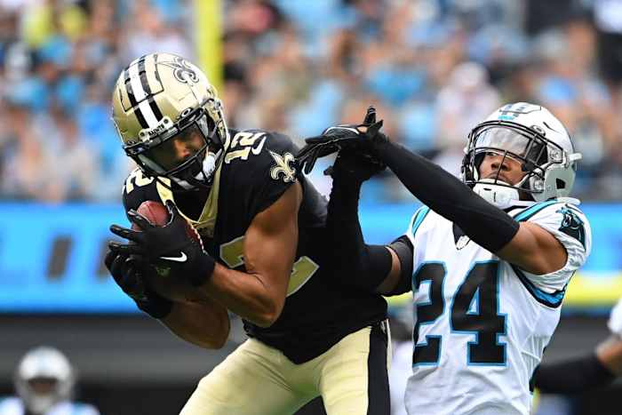 Sep 25, 2022; New Orleans Saints wide receiver Chris Olave (12) catches the ball against Carolina Panthers cornerback CJ Henderson (24). Mandatory Credit: Bob Donnan-USA TODAY Sports