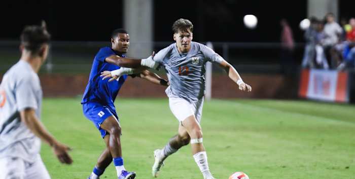 Virginia Cavaliers men's soccer defenseman Moritz Kappelsberger dribbles the ball against the Duke Blue Devils.