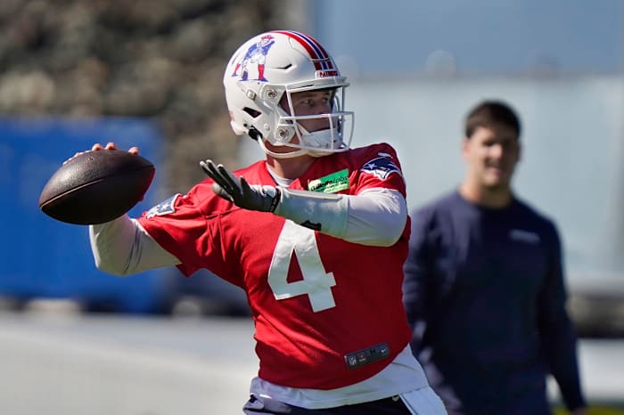 New England Patriots quarterback Bailey Zappe winds up to pass during an NFL football practice, Thursday, Oct. 6, 2022, in Foxborough, Mass.