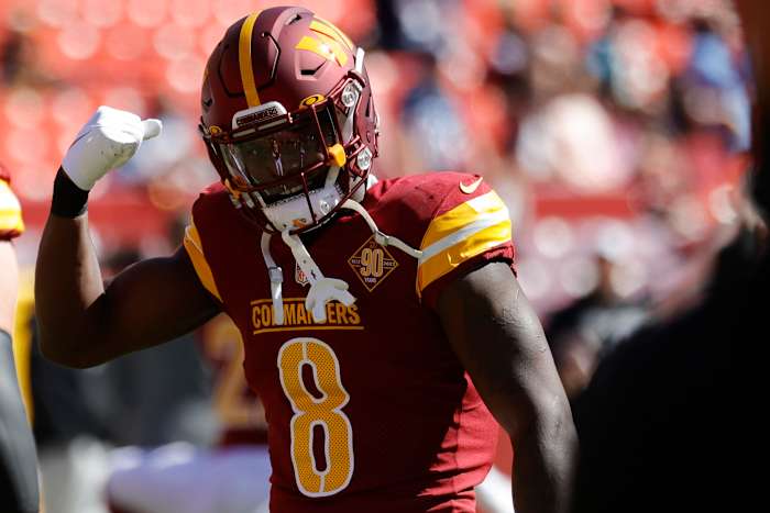 Washington Commanders running back Brian Robinson (8) stands on the field during warmups prior to the Commanders' game against the Tennessee Titans at FedExField.