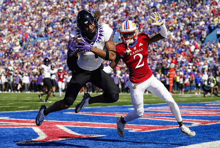 Oct 8, 2022; Lawrence, Kansas, USA; TCU Horned Frogs wide receiver Quentin Johnston (1) catches a touchdown pass against Kansas Jayhawks cornerback Cobee Bryant (2) during the second half at David Booth Kansas Memorial Stadium.