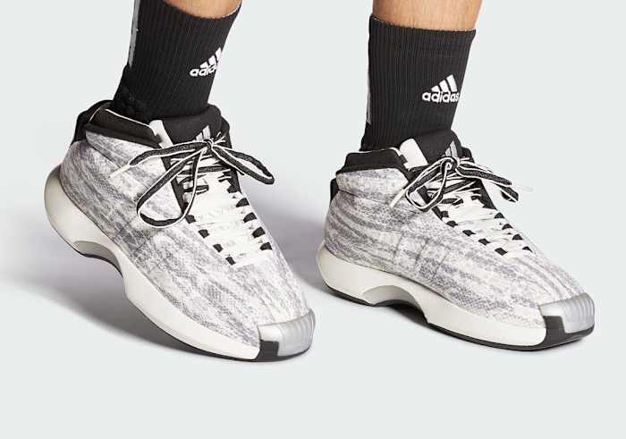 View of white and grey Adidas Crazy 1 shoes.