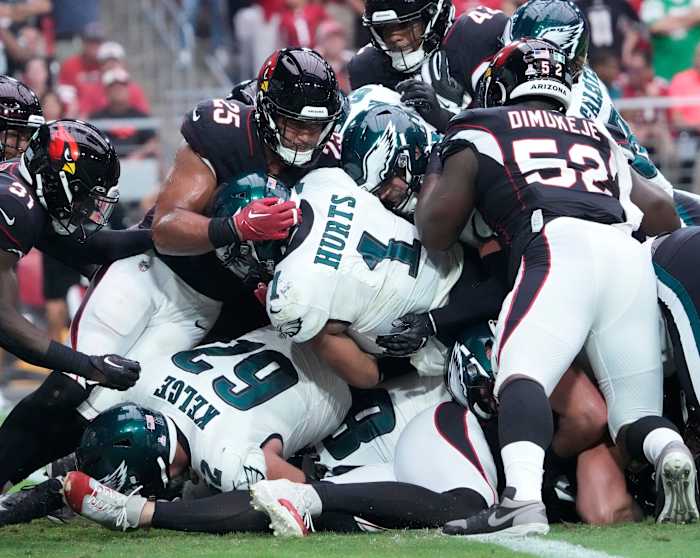 Philadelphia Eagles quarterback Jalen Hurts (1) scores a touchdown against the Arizona Cardinals during the first quarter at State Farm Stadium.