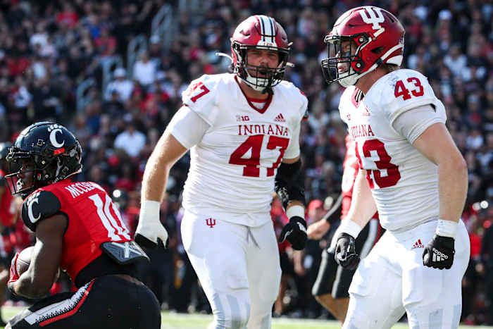 Indiana redshirt freshman linebacker Matt Hohlt (43) celebrates a tackle with JH Tevis (47) during Indiana's game against Cincinnati at Nippert Stadium on Sept. 24.