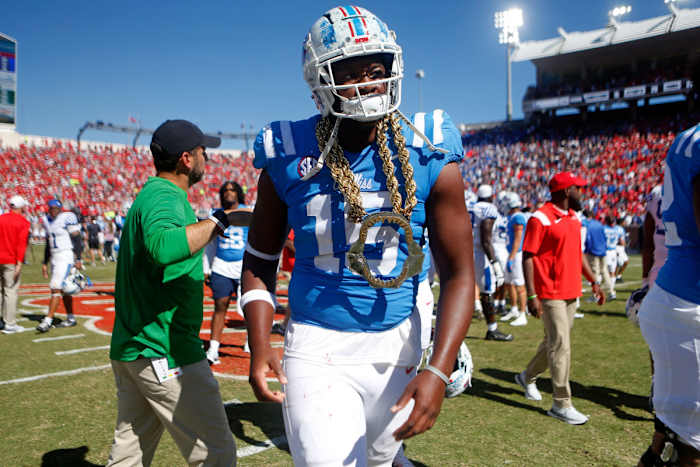 Oct 1, 2022; Oxford, Mississippi, USA; Mississippi Rebels defensive end Jared Ivey (15) walks off the field with the turnover necklace after defeating the Kentucky Wildcats at Vaught-Hemingway Stadium. Ivey forced a fumble late during the fourth quarter to help seal the victory. Mandatory Credit: Petre Thomas-USA TODAY Sports