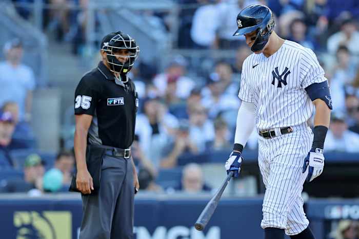 New York Yankees right fielder Aaron Judge (99) complains about a called strike three against the Cleveland Guardians with home plate umpire Jeremie Rehak (35) during the fifth inning in game two ... Brad Penner-USA TODAY Sports