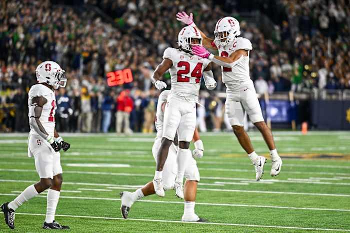 South Bend, Indiana, USA; Stanford Cardinal safety Patrick Fields (24) and safety Jonathan McGill (2) celebrate after a defensive stop in the first quarter against the Notre Dame Fighting Irish at Notre Dame Stadium.