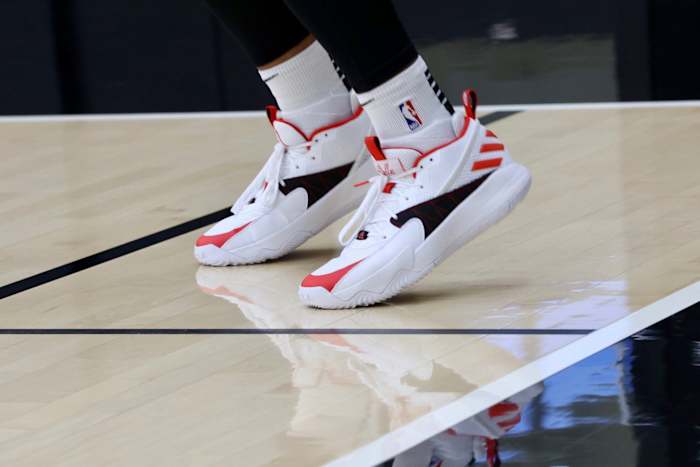 Damian Lillard's white, black, and red Adidas shoes.